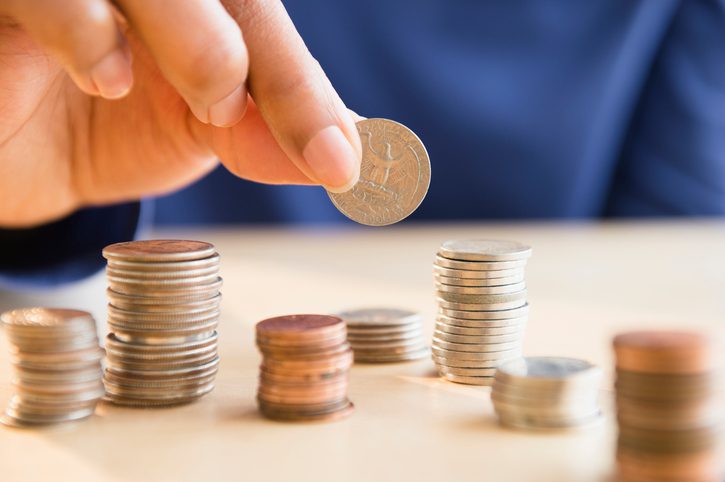 American Air Heating & Cooling | Rock Hill, SC | woman stacking coins